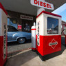 An old gas station with Borgward cars