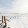 Gate between snow covered fields, East Farndon