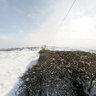 Stile near radio tower in the snow, East Farndon