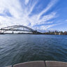 opera house at sunset with bridge and Sydney skyline