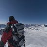 Descending the narrow summit ridge on Mönch in the Swiss Alps